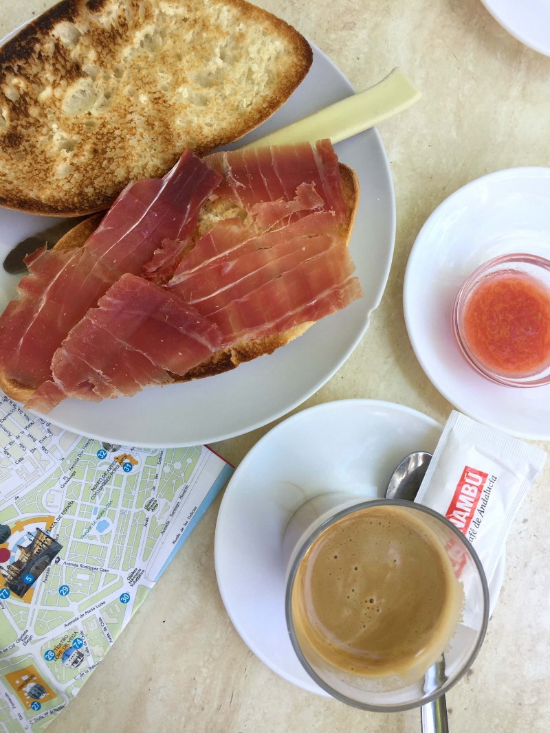 When you visit Seville in Spain, make sure you eat breakfast like a local! Pan con tomate with jamon is a must try. Find out other Top things to see and do in Seville.