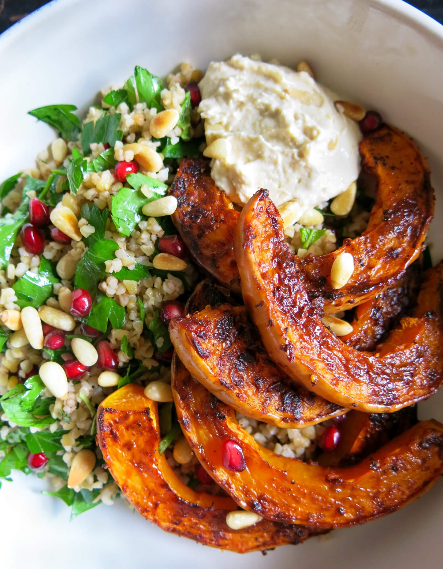 A quick and easy vegetarian salad recipe. Includes butternut squash, bulgar wheat, harrisa, pomegranate and pine nuts.
