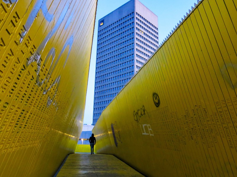 The Luchtsingel bridge in Rotterdam. The bright yellow wooden structure is a pedestrian pathway that connects Rotterdam Centraal station with the historic Laurenskwartier district.