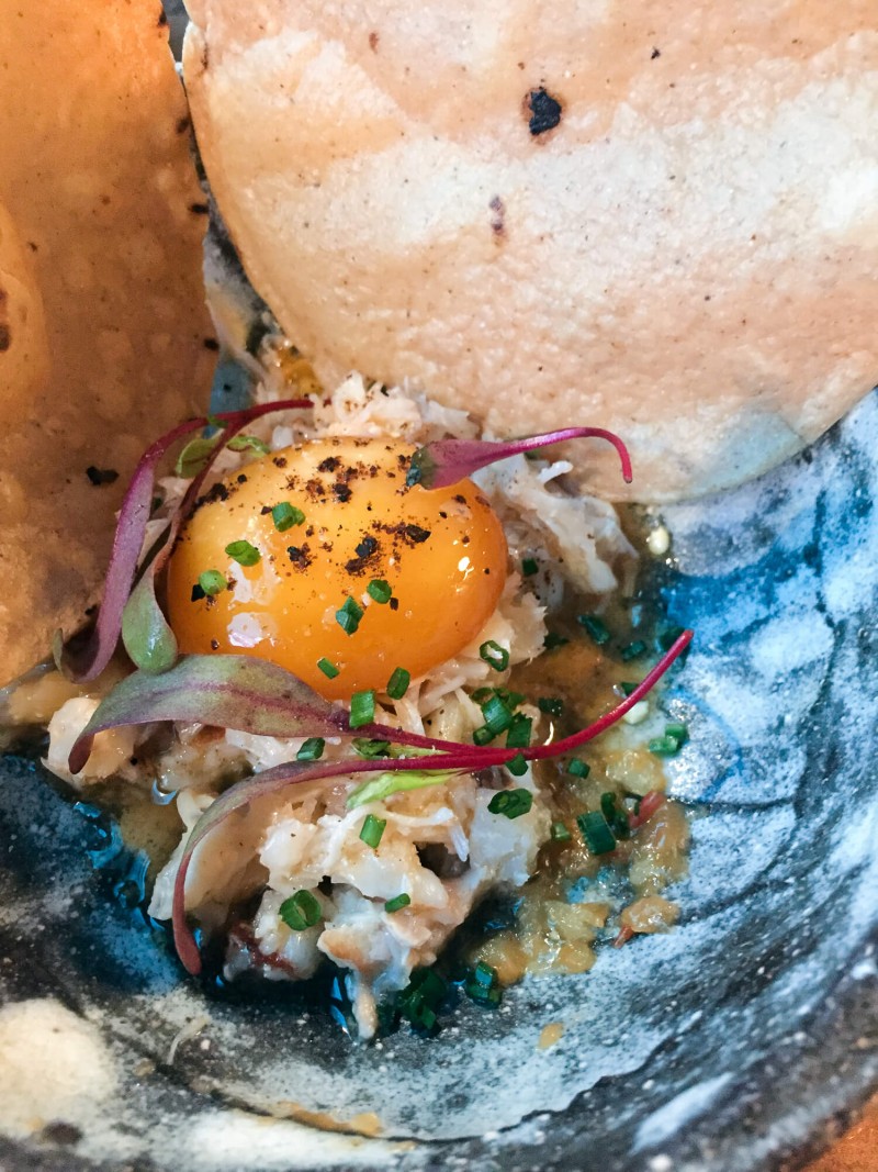The crab and bone marrow nachos with a cured egg yolk at Breddos Tacos. My favourite taco place in London!